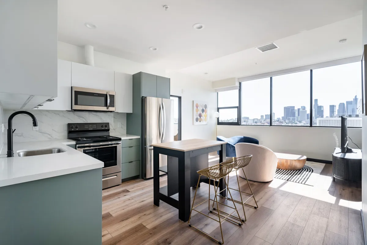 Living room in a 1-bedroom at Atlas House with package lockers, Koreatown LA