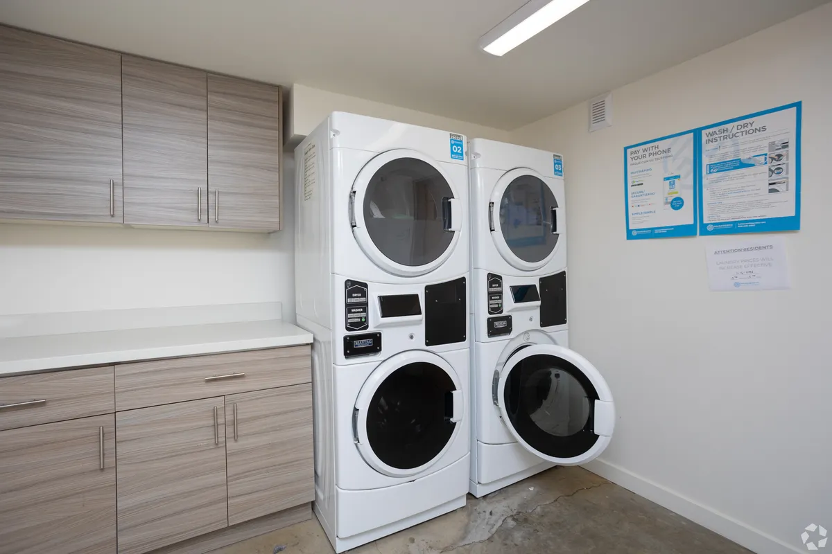 Shared laundry room in U20 Apartments co-living spaces, Seattle